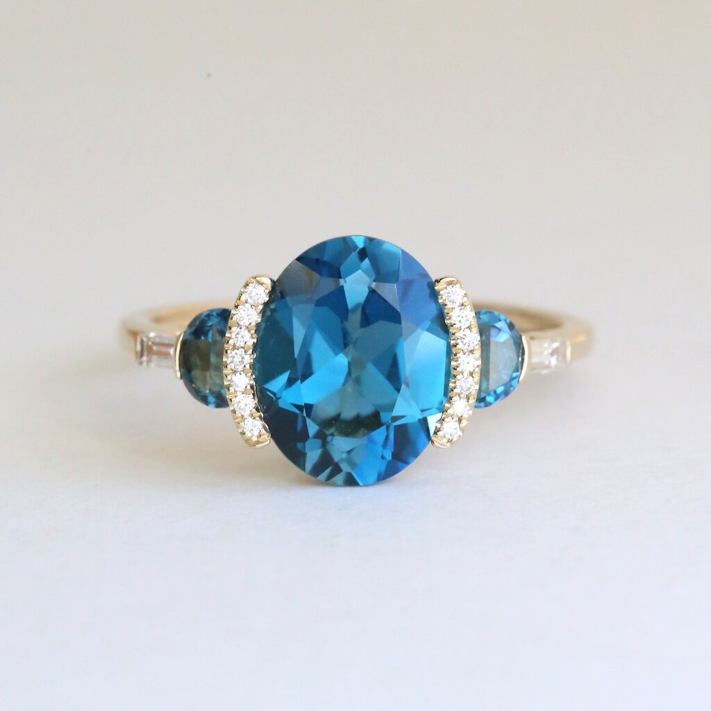American Jewelry 14k Yellow Gold 3.37ctw London Blue Topaz .11ctw Diamond Three Stone Ring
