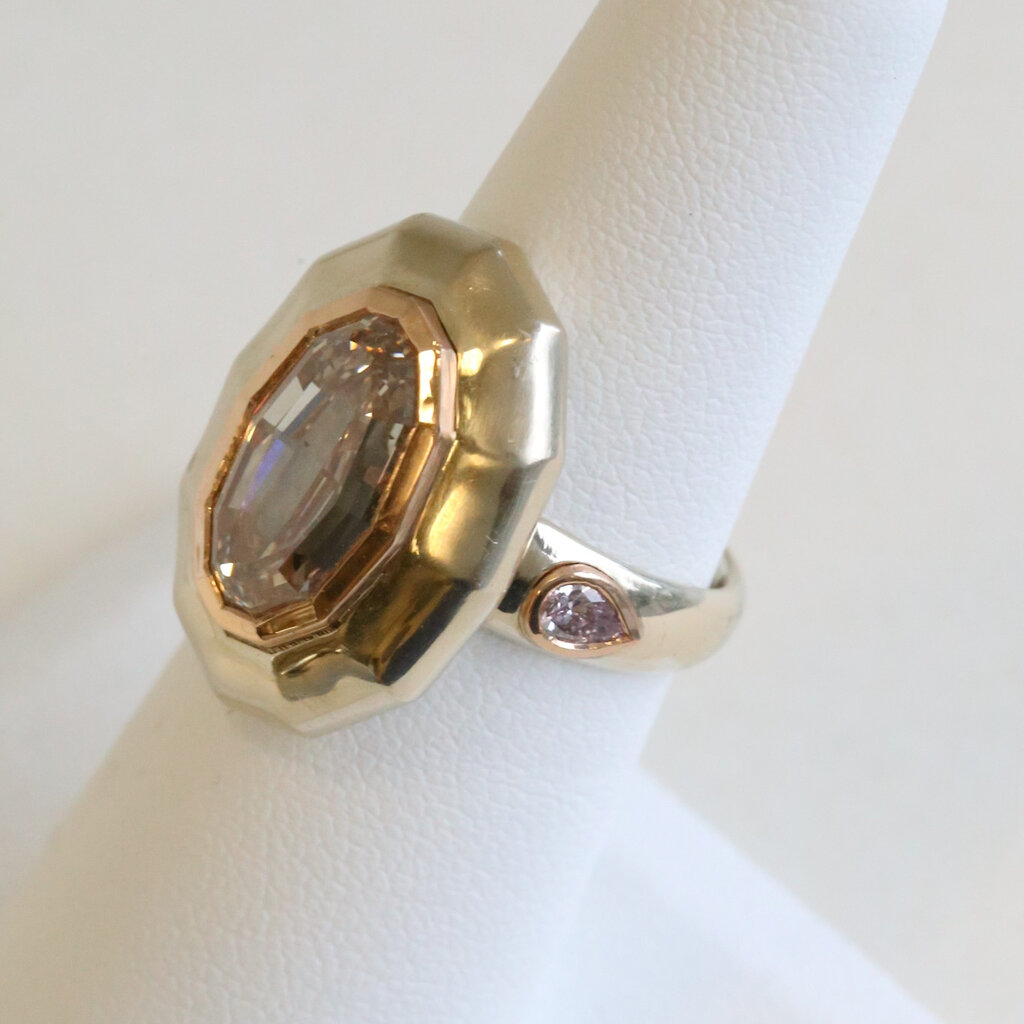 American Jewelry 18k Gold 5.39ctw (5.04 Fancy Light Brown/SI1 GIA Ctr) Modified Oval Step Cut Bezel Ring w/ Pink Pear Diamond Accent Ring