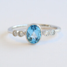 American Jewelry 14k White Gold .12ctw Diamond .75ct Blue Topaz Oval Milgrain Ring