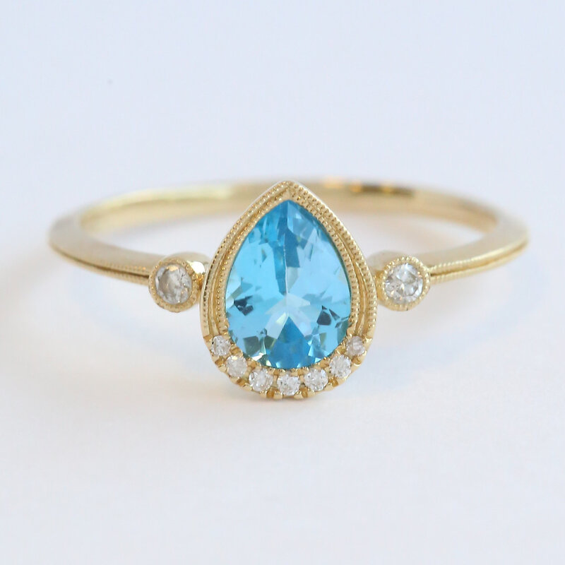 American Jewelry 14k Yellow Gold .80ct Blue Topaz .08ctw Diamond Accent Milgrain Ring (Size 7)
