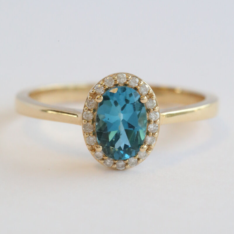 American Jewelry 14k Yellow Gold .90ct Blue Topaz .12ctw Diamond Oval Halo Ring (Size 7)