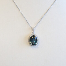 American Jewelry 14k White Gold .90ct Blue Topaz .12ctw Diamond Oval Halo Necklace