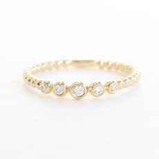 American Jewelry 14k Yellow Gold .08ctw Graduated Diamond Bezel Beaded Wedding Band
