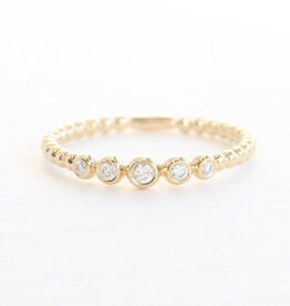 American Jewelry 14k Yellow Gold .08ctw Graduated Diamond Bezel Beaded Wedding Band