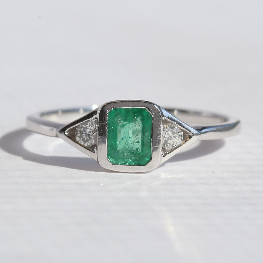 American Jewelry 14k White Gold .60ct Emerald .10ctw Diamond 3 Stone Ring