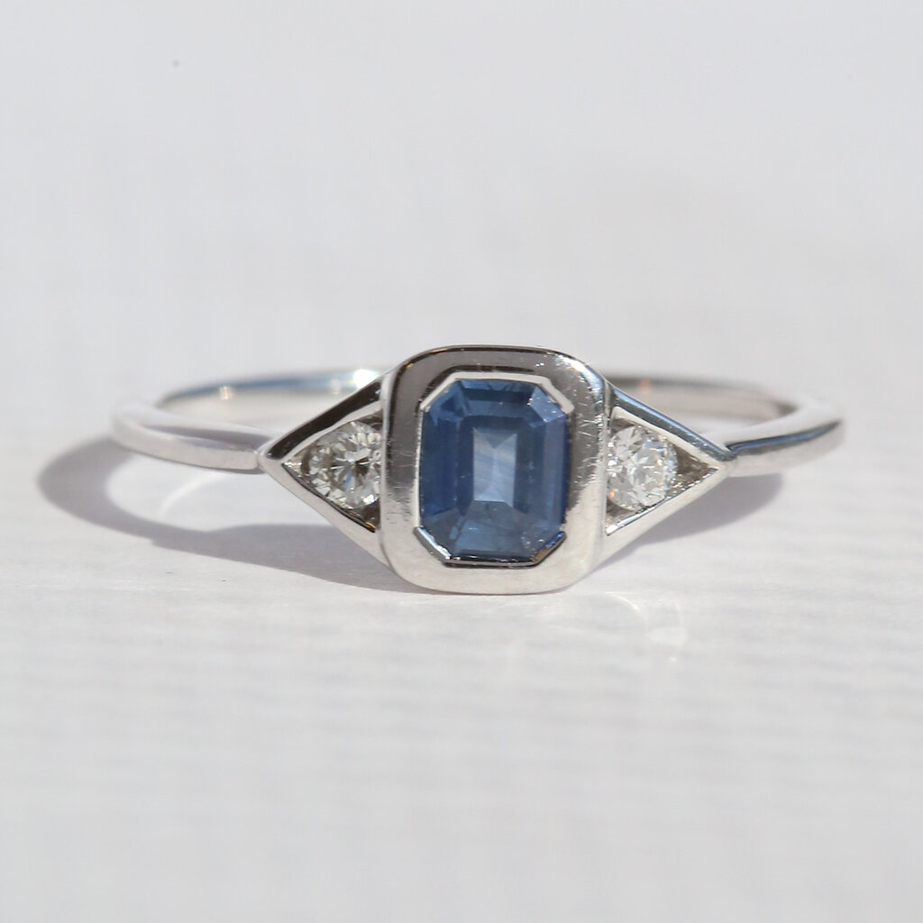 American Jewelry 14k White Gold .65ct Sapphire .10ctw Diamond Emerald Cut 3 Stone Ring