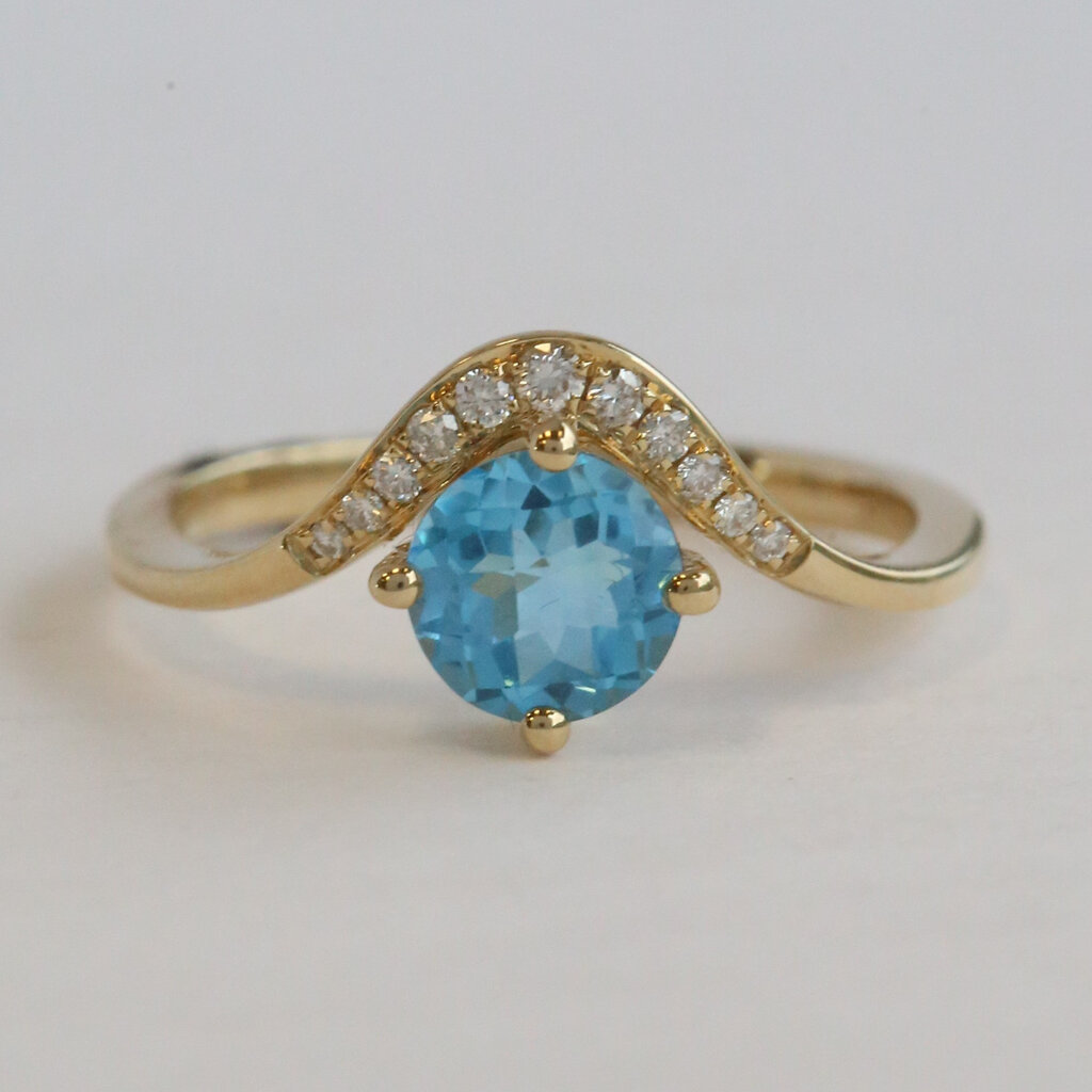 American Jewelry 14k Yellow Gold 1.07ct Blue Topaz .09ctw Diamond Wave Bypass Ring