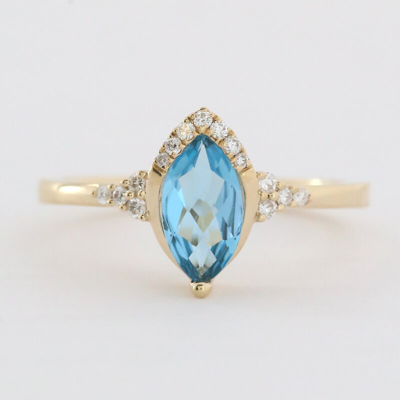 American Jewelry 14k Yellow Gold 1.2ct Blue Topaz .10ctw Diamond Accent Marquise Ring