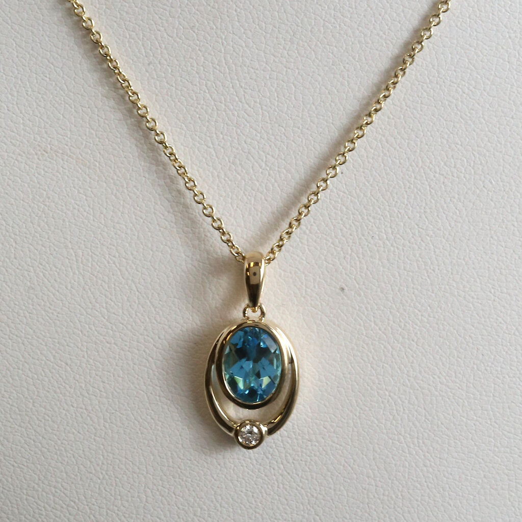American Jewelry 14k Yellow Gold 1.45ct Blue Topaz .04ct Diamond Accent Oval Bezel Necklace