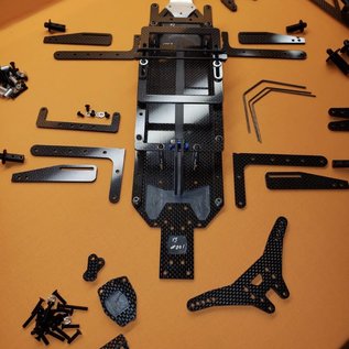 Trap OMB Design OMB1007  O.M.B 1007 v3 AE 6.1,6.2,6.3 series DC6.1.2.3 Chassis Kit w/Pro Adust Wheelie Bar, trans height shim kit, rear sway bar wire