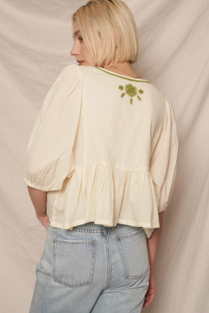 En Creme Puff Sleeve Peplum Top with Embroidery
