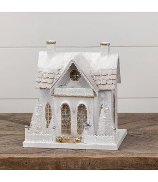 Snow Covered Cottage with Bottlebrush Trees