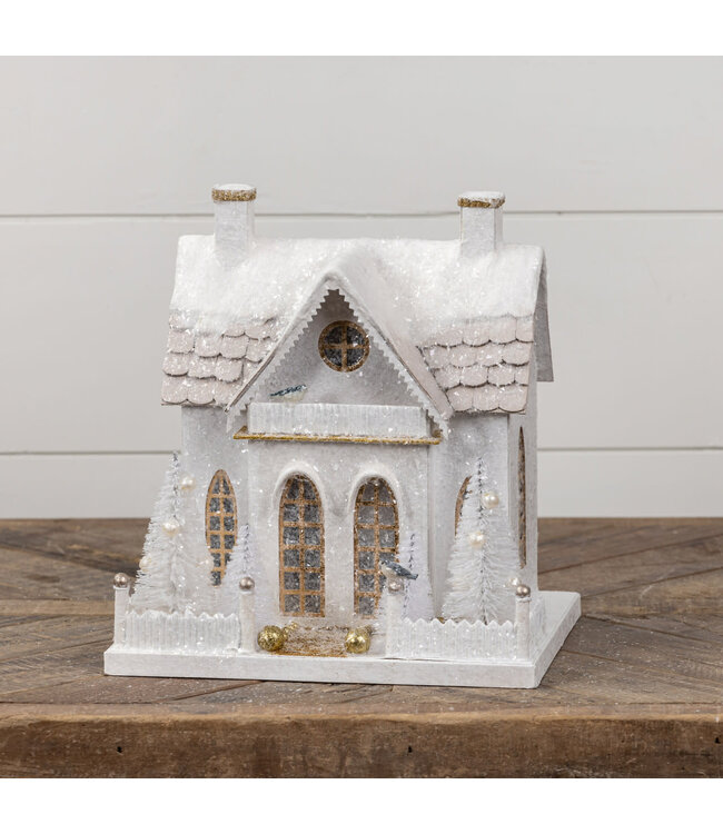 Snow Covered Cottage with Bottlebrush Trees