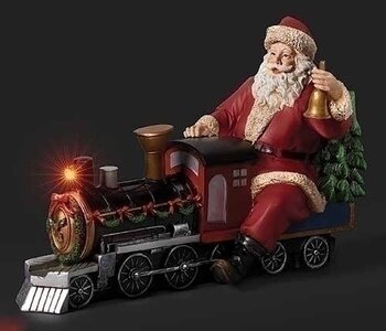 Père Noël assis sur locomotive musical à piles