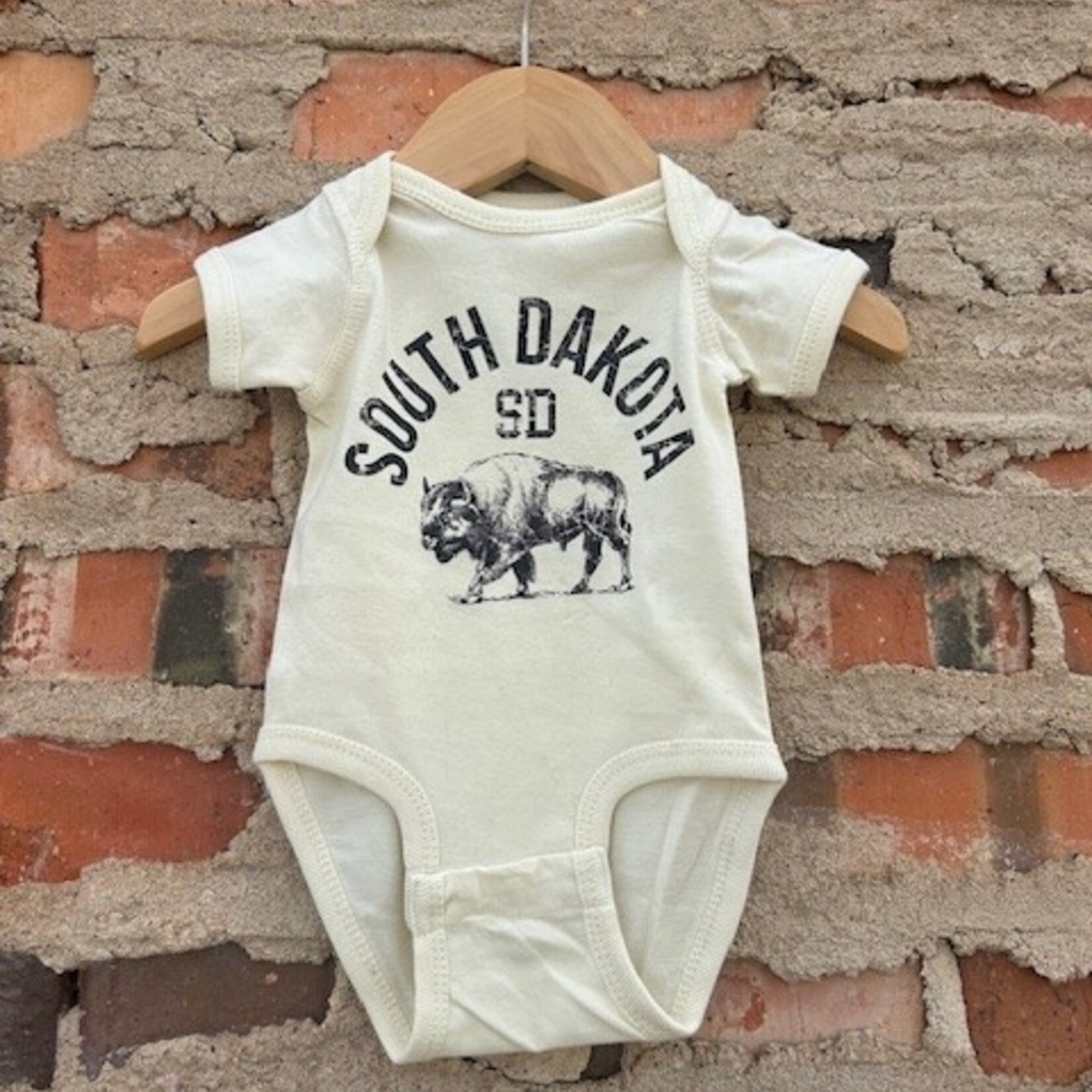 Shamaim South Dakota Baby Onesie - Natural
