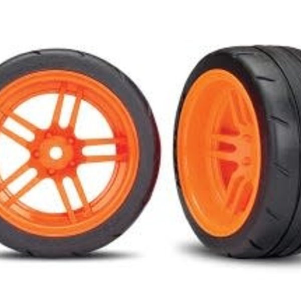 Traxxas Tires and wheels, assembled, glued (split-spoke orange wheels, 1.9' Response tires) (extra wide, rear) (2) (VXL rated)