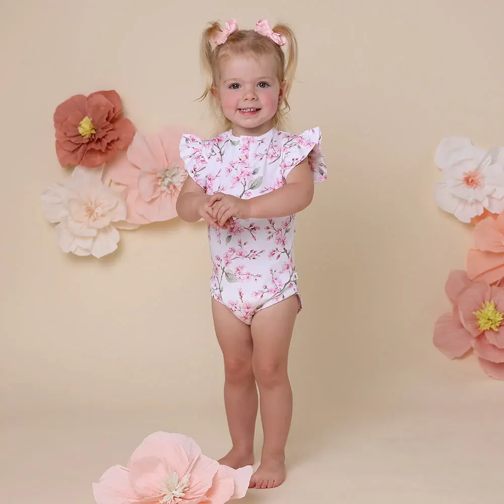 Snuggle Hunny Kids Snuggle Hunny Cherry Blossom Short Sleeve Organic Bodysuit with Frill