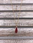 Red Druzy Oval Pendant on a Gold Necklace