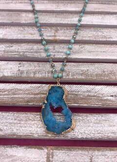 Long Gold Necklace with Turquoise Beads and a Blue Geode Pendant