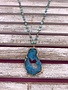 Long Gold Necklace with Turquoise Beads and a Blue Geode Pendant