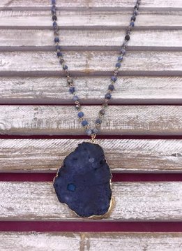 Long Gold Necklace with Blue Beads and a Blue Stone Pendant