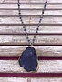Long Gold Necklace with Blue Beads and a Blue Stone Pendant