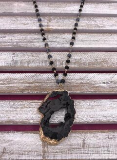 Long Gold Necklace with Black Beads and a Black Geode Pendant