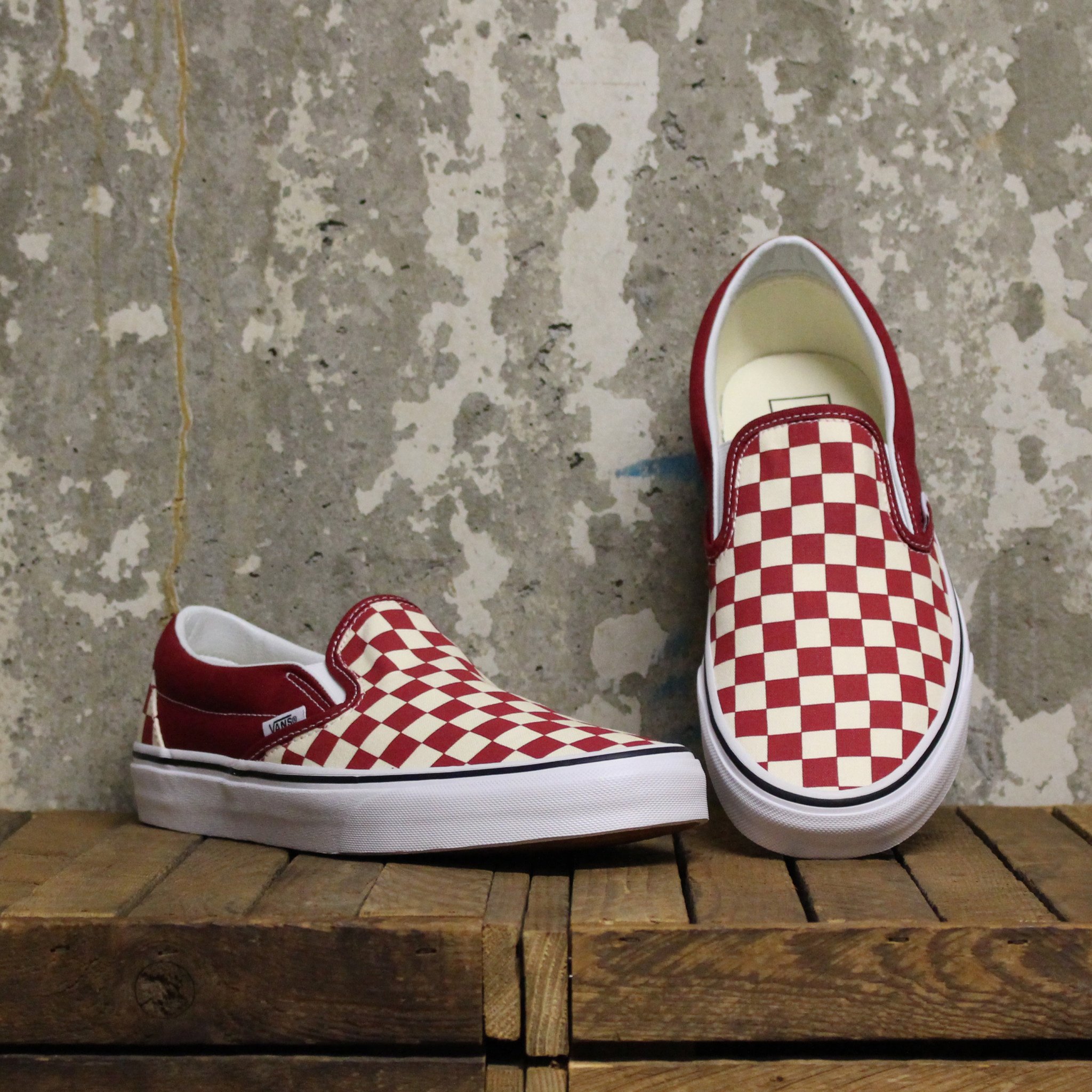 red and white checkerboard vans slip on