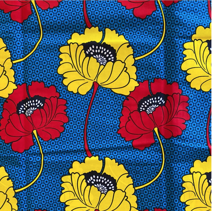 Fabrics USA Inc Ankara Wax Print— Large yellow and red poppies on blue background