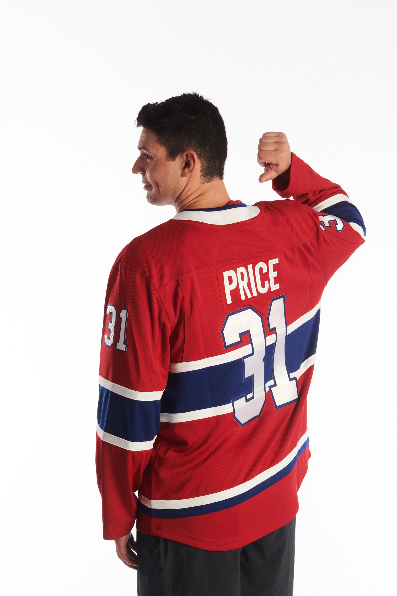 Carey Price Montreal Canadiens Unsigned Red Jersey in Net Photograph