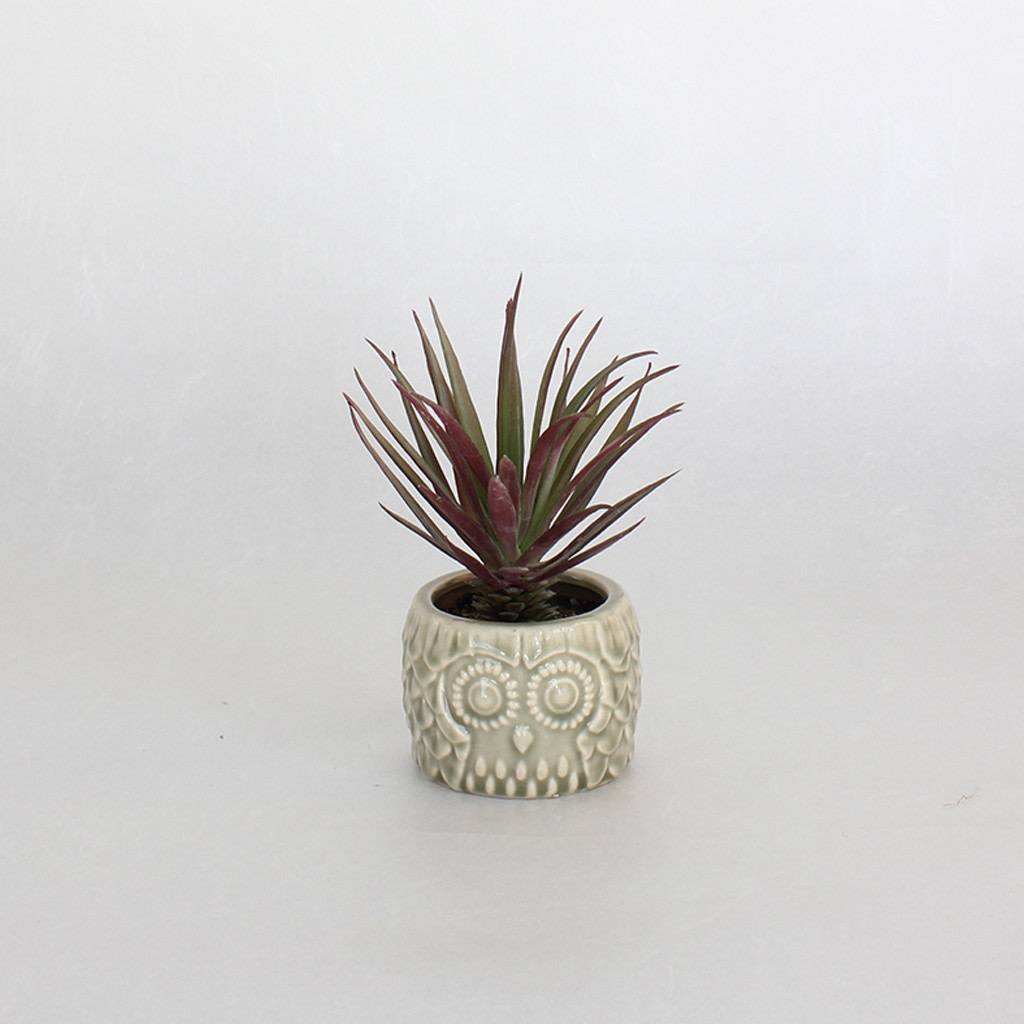 FAUX PLANT IN SMALL OWL CONTAINER