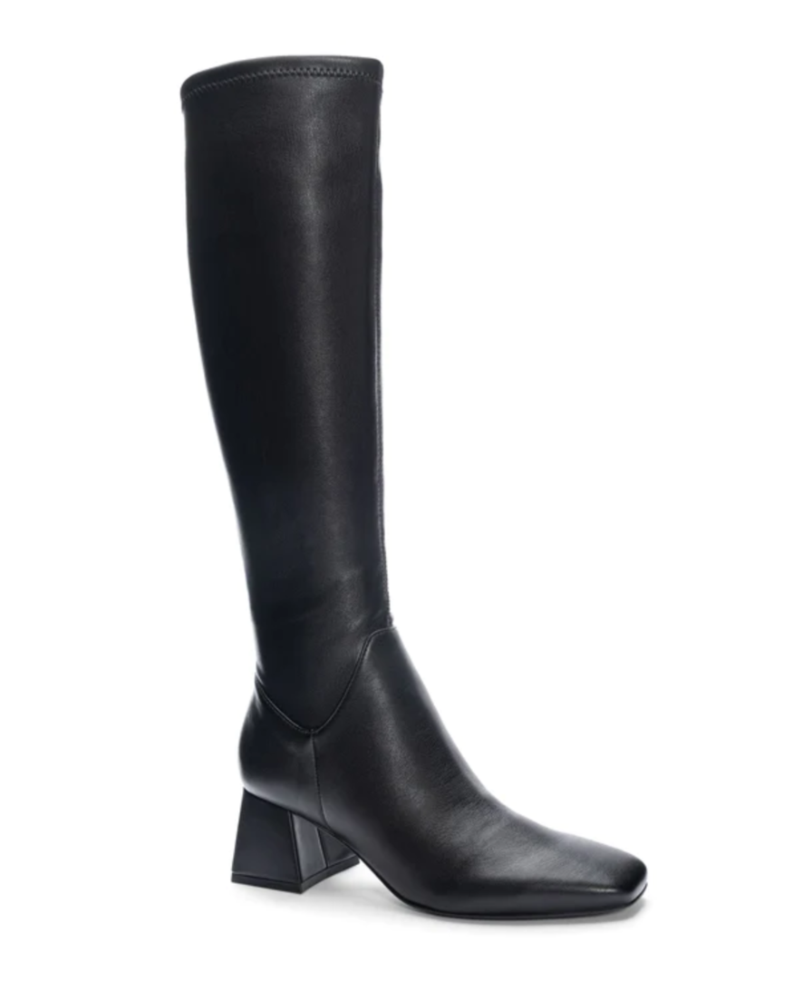 black trousers wearing black leather knee length riding boots
