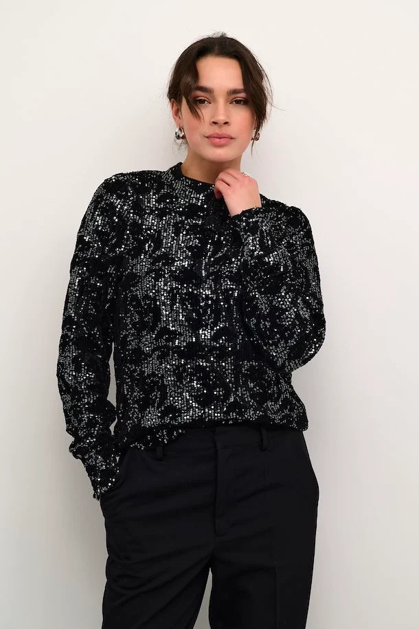 white sequin blouse