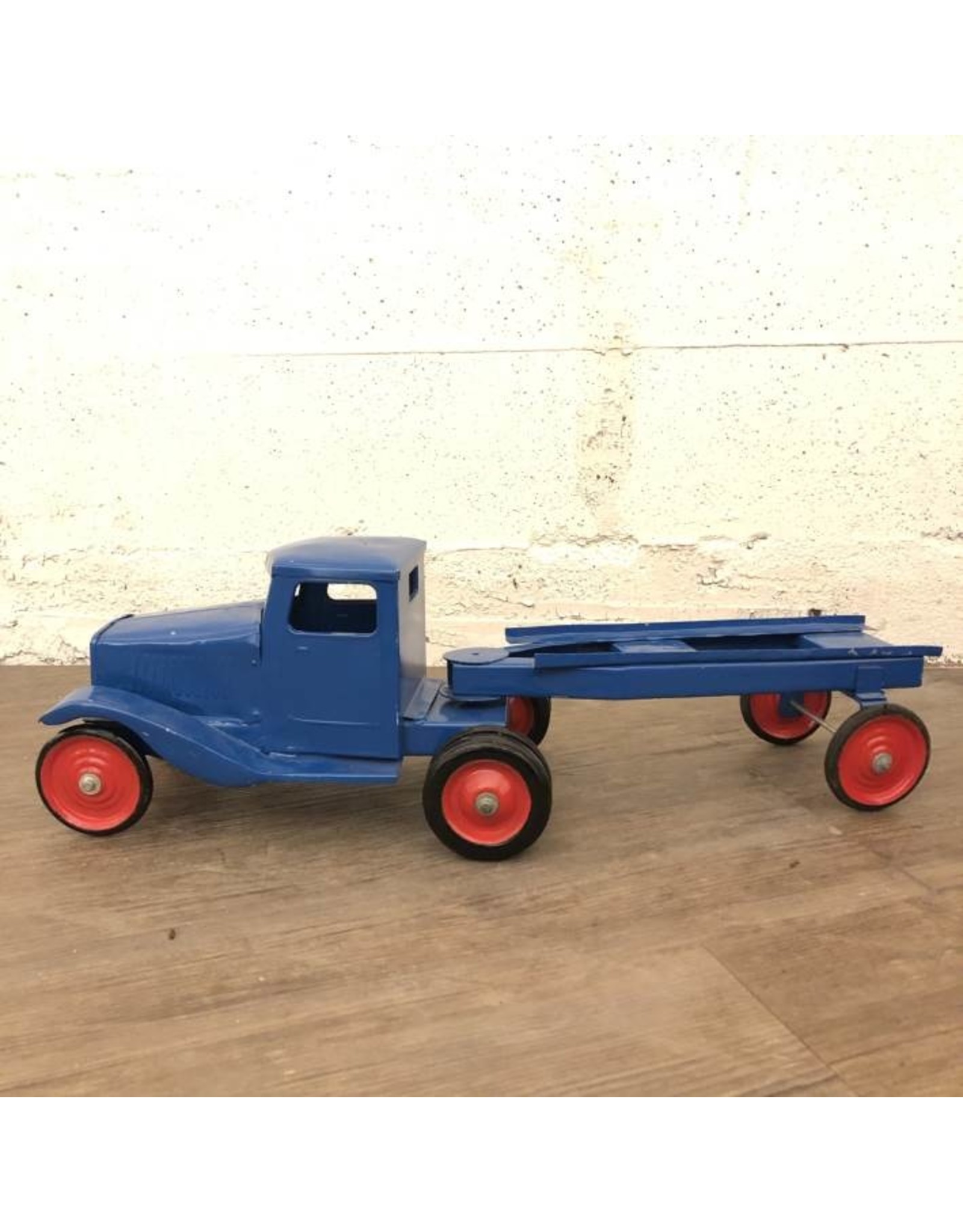 Toy truck and trailer painted blue