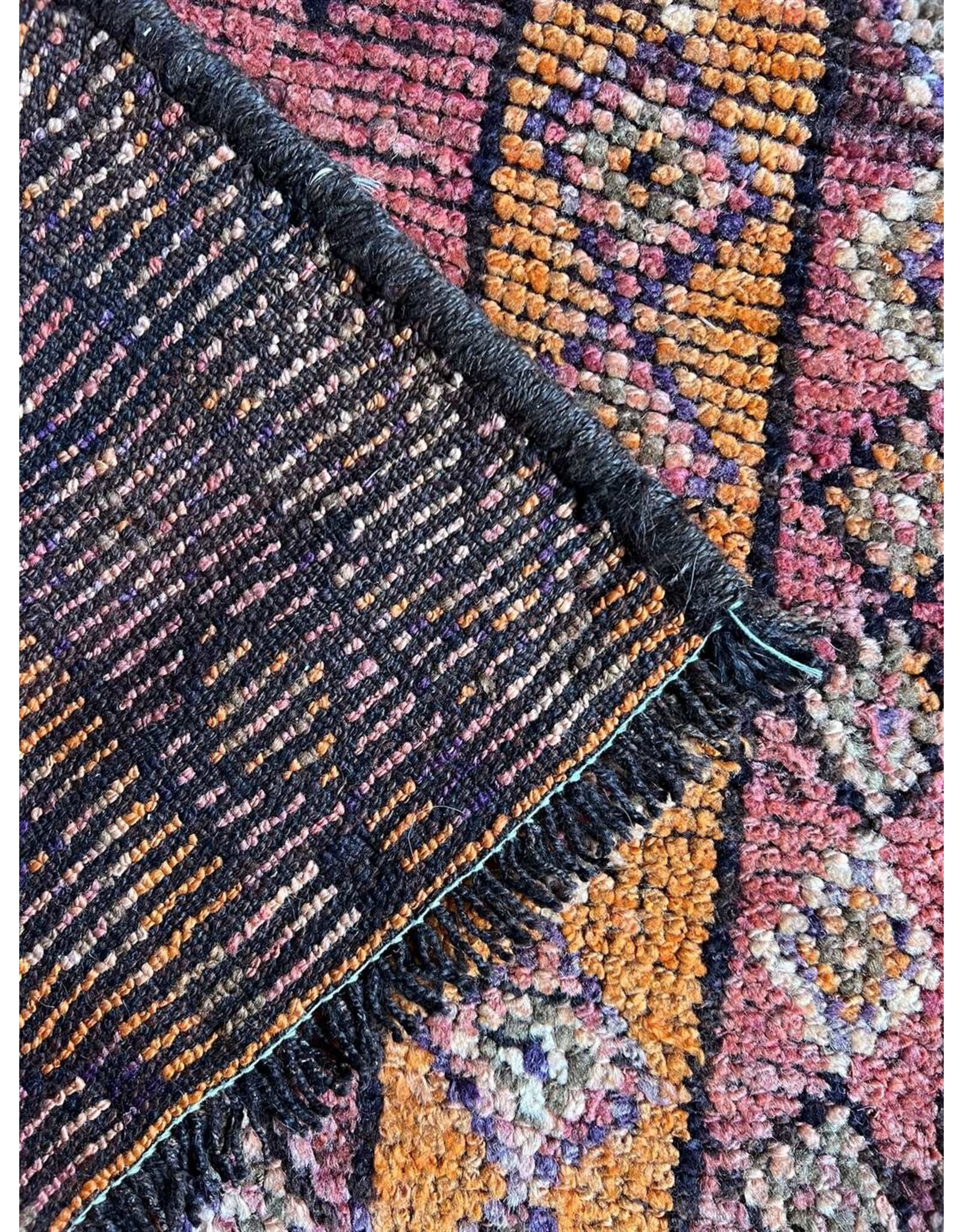 7'.7" x 3' hand knotted wool rug