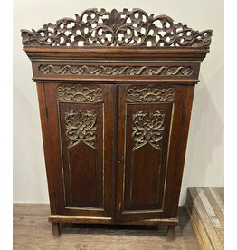 Intricately carved cabinet