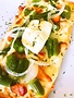 Smoked salmon, asparagus, goat cheese & mozzarella pizza