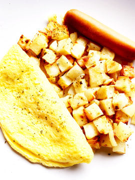 Cheese omelette, sausage & homemade potatoes