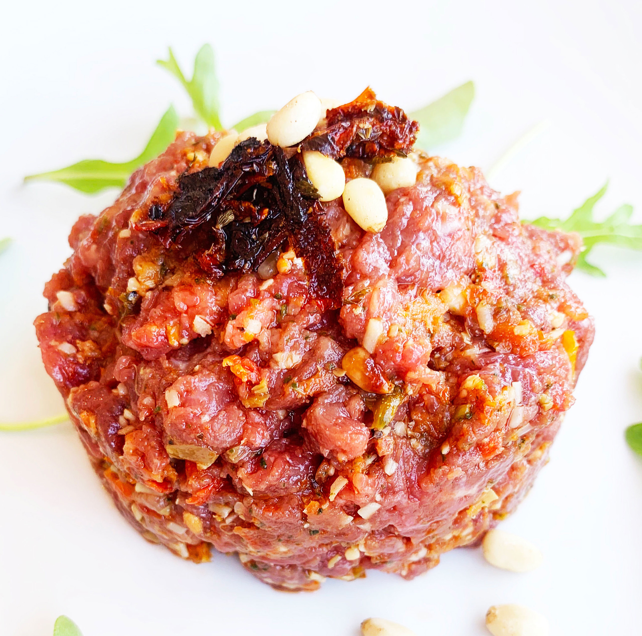 Beef, sundried tomatoes, parmesan, prosciutto & pine nuts tartare