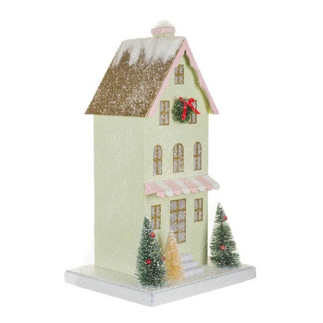 Green Illuminated House Display with Snowy Gold Roof