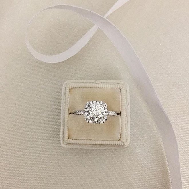 Cushion shaped diamond halo engagement ring