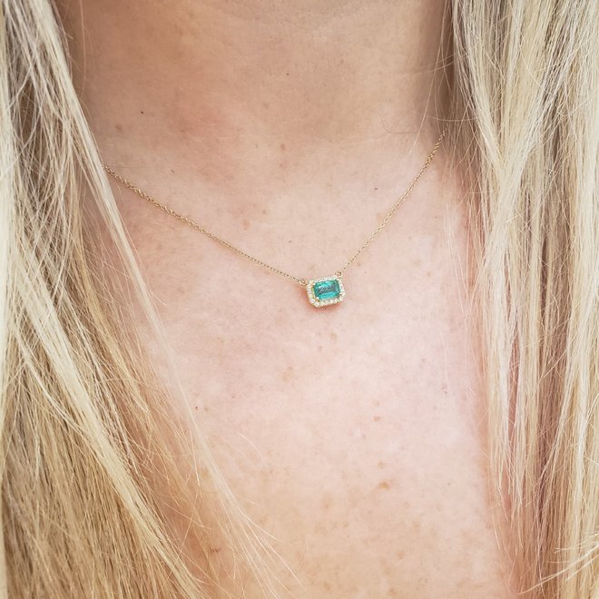 Emerald and diamond halo necklace