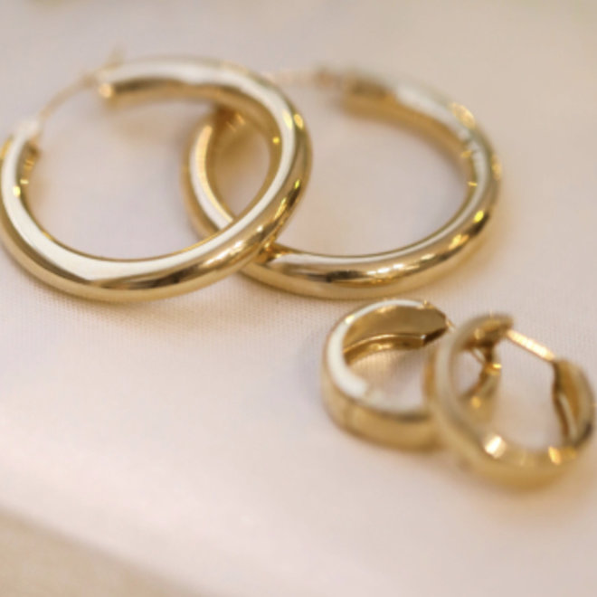 Yellow gold wide huggie earrings