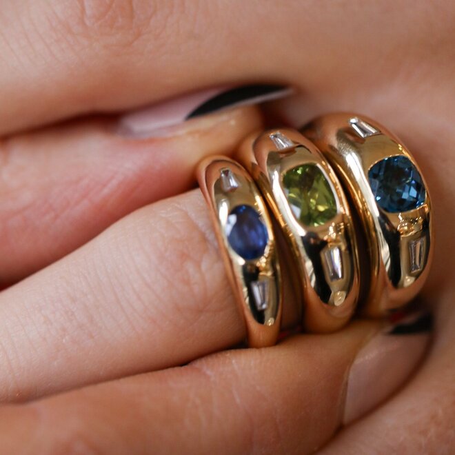 Domed peridot and diamond band