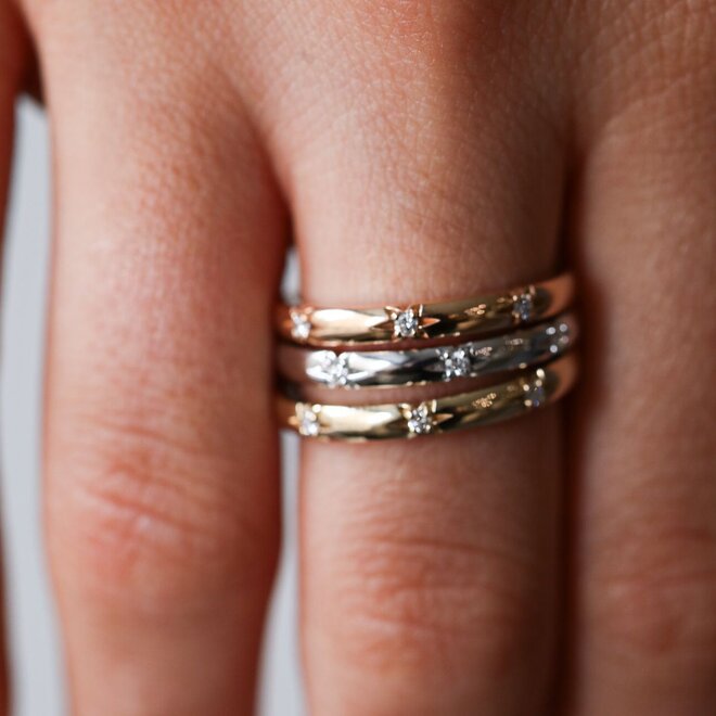 Diamond starburst white gold band
