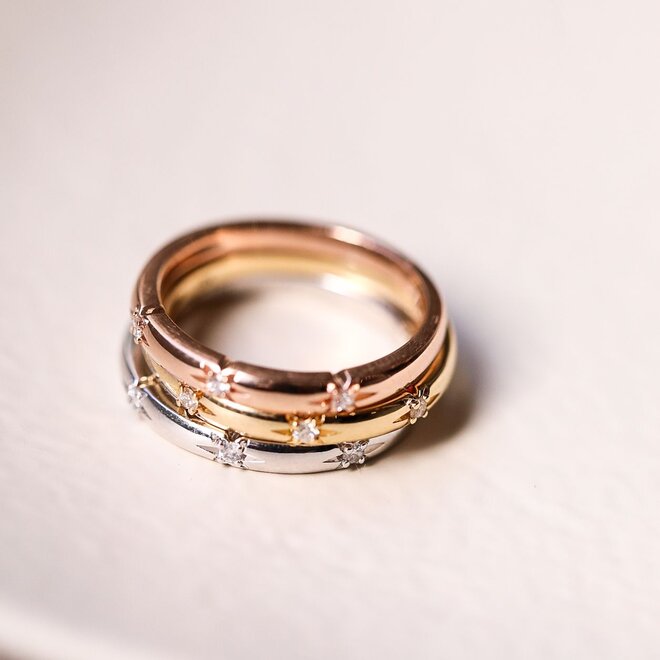 Diamond starburst white gold band