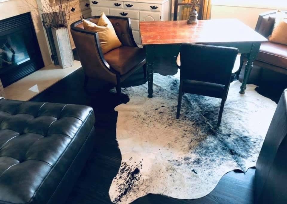 Cowhide Rug on Black hardwood floor