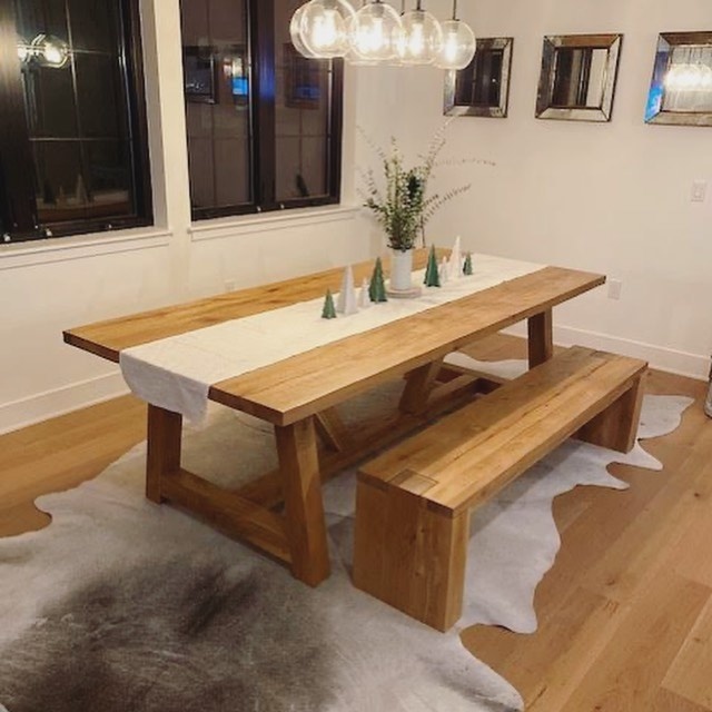 Gray Cowhides Layered in a Dining Room