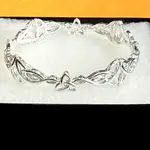 0011 PREMIERE Bracelet: Silver Trinity Metal Stretch