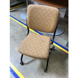 Tan Patterned Cloth Cushioned Chair Black Metal Frame On Castors 10/3/23